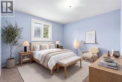 Room featuring light blue walls and neutral carpeting - 