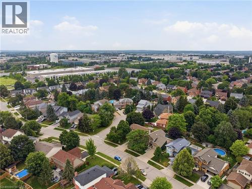 Aerial perspective showcasing a residential area with varied housing styles and mature tree coverage - 19 Alona Avenue, Cambridge, ON - Outdoor With View