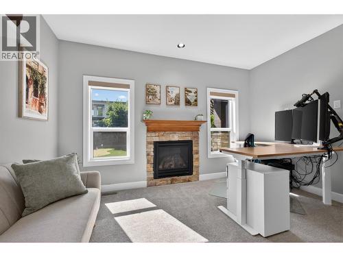 4588 Raymer Road, Kelowna, BC - Indoor Photo Showing Other Room With Fireplace