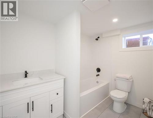Modern bathroom featuring a white vanity with a rectangular undermount sink, a light-colored countertop, and a matte black faucet - 781 Ninth Avenue Unit# Lower, Hamilton, ON - Indoor Photo Showing Bathroom