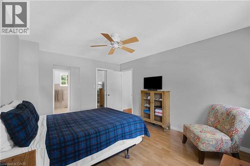 Bedroom featuring wood-finish flooring, light grey painted walls, and a ceiling fan - 123 Benn Drive, Cambridge, ON - Indoor Photo Showing Bedroom
