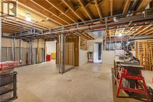 Unfinished basement featuring exposed wood joists, concrete flooring, and metal stud framing - 123 Benn Drive, Cambridge, ON - Indoor Photo Showing Basement