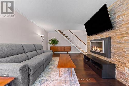 201 - 12 Corkstown Road, Ottawa, ON - Indoor Photo Showing Living Room With Fireplace