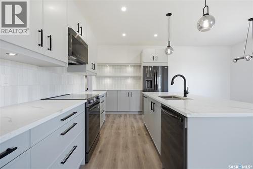 224 Froese Crescent, Warman, SK - Indoor Photo Showing Kitchen With Double Sink With Upgraded Kitchen