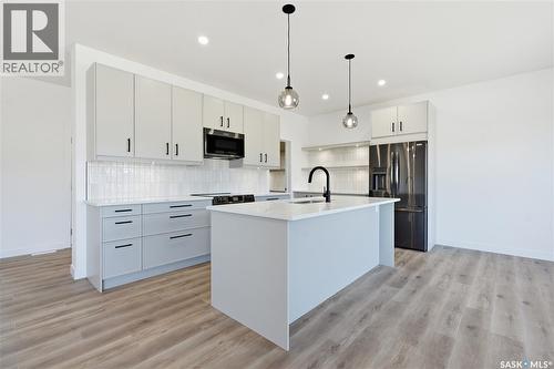 224 Froese Crescent, Warman, SK - Indoor Photo Showing Kitchen With Upgraded Kitchen