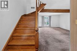Hardwood staircase with turned newel post and balustrade - 