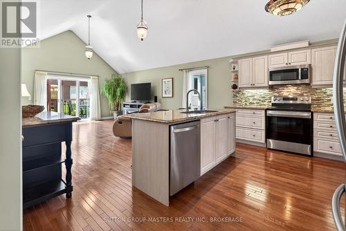 Open concept  with walk out - 133 Britannia Crescent, Loyalist (Bath), ON - Indoor Photo Showing Kitchen With Upgraded Kitchen