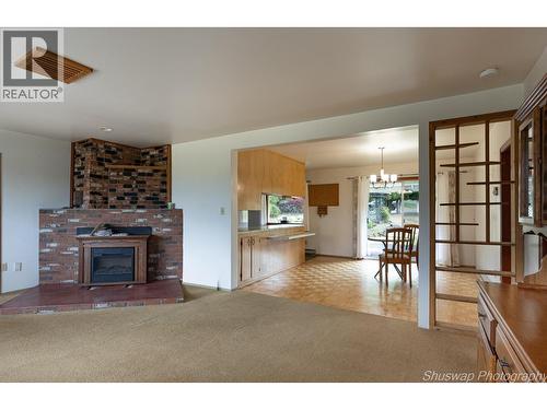 6350 Lakeshore Drive Ne, Salmon Arm, BC - Indoor Photo Showing Living Room With Fireplace