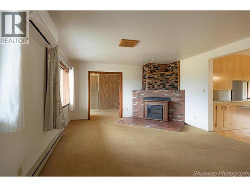 6350 Lakeshore Drive Ne, Salmon Arm, BC - Indoor Photo Showing Living Room With Fireplace