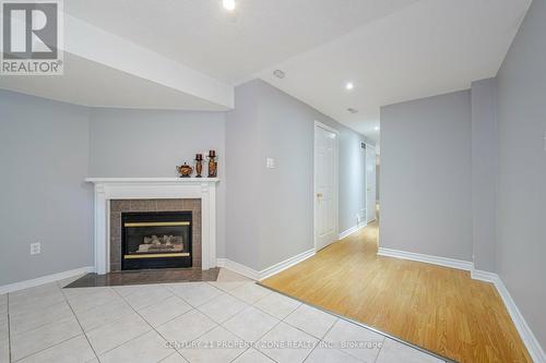 Fireplace in Basement - 86 Rory Road, Toronto, ON - Indoor Photo Showing Living Room With Fireplace