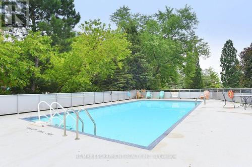 401 - 2263 Marine Drive, Oakville, ON - Outdoor With In Ground Pool With Backyard