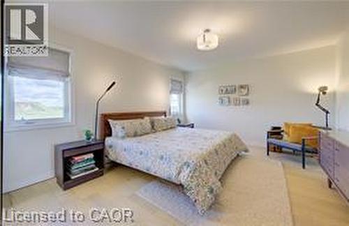 Bright room featuring light-toned flooring and white walls - 290 William Street, Elmira, ON - Indoor Photo Showing Bedroom
