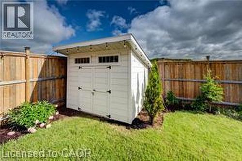 White detached shed with double doors and transom windows - 290 William Street, Elmira, ON - Outdoor