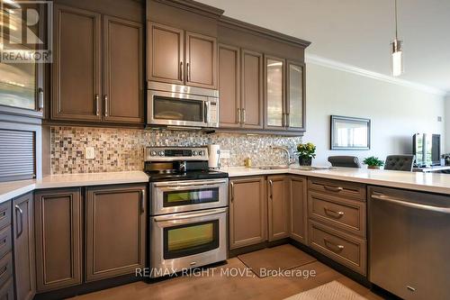 Kitchen with Upgraded Cabinetry and Countertops - 605 - 80 Orchard Point Road, Orillia, ON - Indoor Photo Showing Kitchen With Stainless Steel Kitchen