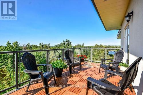 Lake Couchiching in the distance - 605 - 80 Orchard Point Road, Orillia, ON - Outdoor With Balcony With Exterior