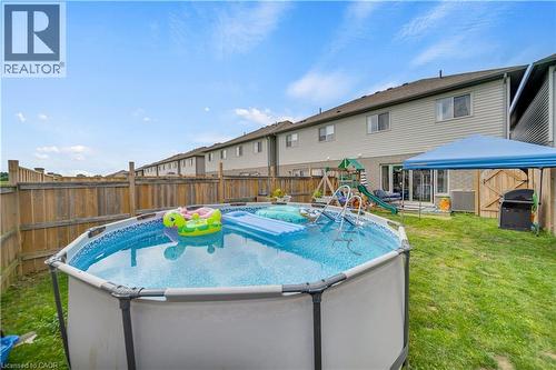 1450 Caen Avenue, Woodstock, ON - Outdoor With Above Ground Pool With Backyard