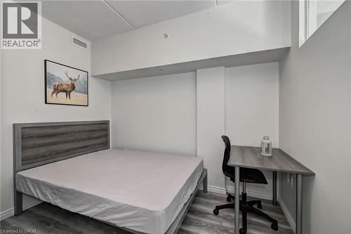 Bright room featuring light wood-finish flooring and a white ceiling - 275 Larch Street Unit# F209, Waterloo, ON - Indoor