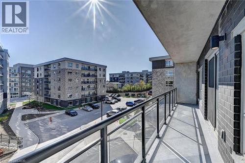 Outdoor balcony featuring a glass and metal railing system - 275 Larch Street Unit# F209, Waterloo, ON - Outdoor With Balcony
