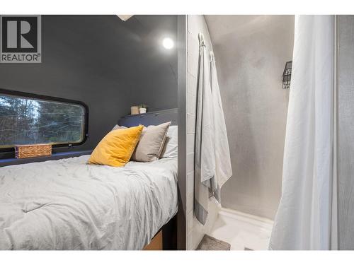 Hot water on demand shower with Hand held rain shower head. - 6474 Deer Run Road Lot# 11, Magna Bay, BC 