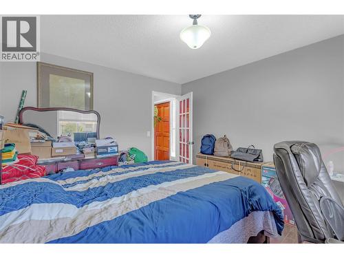 1675 Thayer Court Unit# 1, Kelowna, BC - Indoor Photo Showing Bedroom