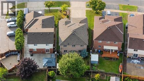 Rear exterior of a two-story residence with a multi-gabled roof and brick and siding facade - 888 Paisley Road, Guelph, ON - Outdoor