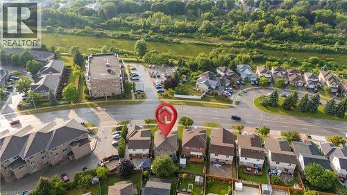 Aerial view of a residential neighborhood featuring detached and attached properties with green spaces - 888 Paisley Road, Guelph, ON - Outdoor With View