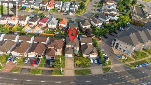 Residential property featuring a driveway, attached garage, and mature landscaping - 888 Paisley Road, Guelph, ON -  With View
