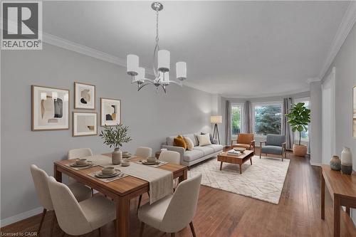 Open-concept living and dining area featuring wood-finish flooring, a contemporary chandelier, crown molding, a bay window, and light gray wall tones - 888 Paisley Road, Guelph, ON - Indoor