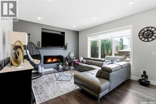 206 Kenaschuk Union, Saskatoon, SK - Indoor Photo Showing Living Room With Fireplace