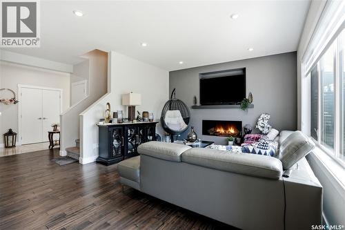 206 Kenaschuk Union, Saskatoon, SK - Indoor Photo Showing Living Room With Fireplace