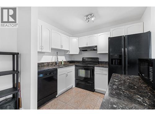 735 Cook Road Unit# 104C, Kelowna, BC - Indoor Photo Showing Kitchen With Double Sink