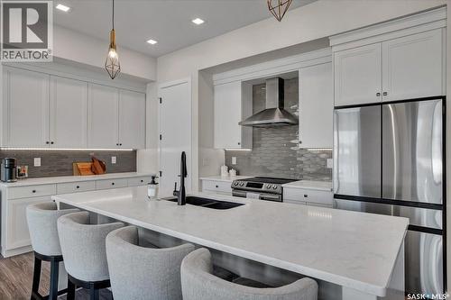 411 Dagnone Terrace, Saskatoon, SK - Indoor Photo Showing Kitchen With Stainless Steel Kitchen With Double Sink With Upgraded Kitchen