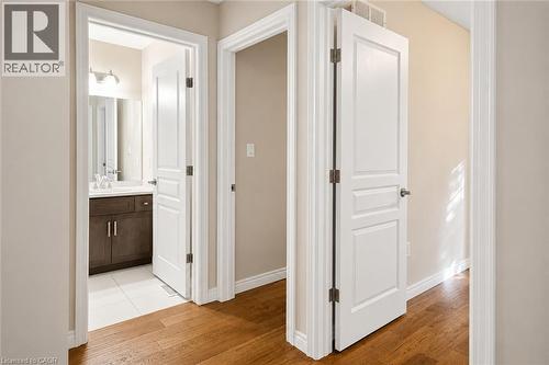 Hallway featuring wood-finish flooring and neutral wall tones - 133 St Leger Street, Kitchener, ON - Indoor Photo Showing Other Room