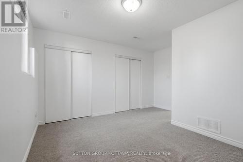 Primary Bedroom - Large Closets - 2563 Longfields Drive, Ottawa, ON - Indoor Photo Showing Other Room