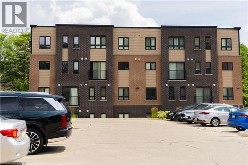 Contemporary multi-story building featuring a brick and siding facade - 190 Century Hill Drive Unit# A5, Kitchener, ON - Outdoor