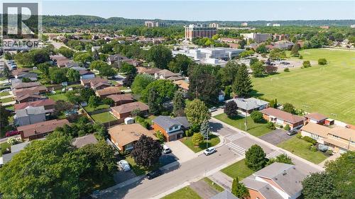 Aerial perspective of a residential neighborhood featuring detached homes with private yards and mature trees - 143 Cromwell Crescent, Hamilton, ON - Outdoor With View