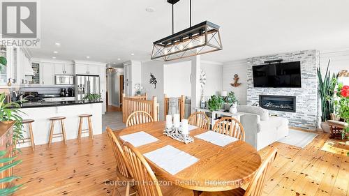 380 Robins Point Road, Tay (Victoria Harbour), ON - Indoor Photo Showing Dining Room With Fireplace