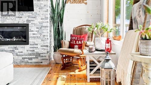 380 Robins Point Road, Tay (Victoria Harbour), ON - Indoor Photo Showing Other Room With Fireplace
