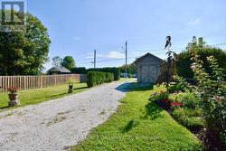 Spacious driveway and utility shed with panel - 