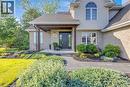 Brick and siding exterior featuring a covered entryway with decorative columns - 25 Brian Drive, Burford, ON  - Outdoor 