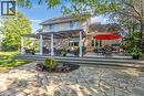 Multi-level rear deck with a pergola-covered section and an expansive flagstone patio - 25 Brian Drive, Burford, ON  - Outdoor With Deck Patio Veranda 