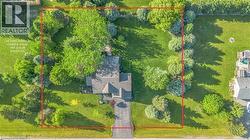 Aerial perspective showcasing a sprawling property with mature trees and extensive green space - 