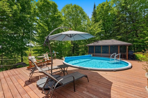 Pool - 57 Mtée De L'Église, Mille-Isles, QC - Outdoor With Above Ground Pool With Deck Patio Veranda With Backyard