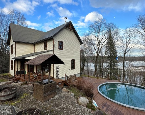 Front of Structure - 57 Mtée De L'Église, Mille-Isles, QC - Outdoor With Above Ground Pool