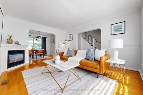67 Cathedral Bluffs Drive, Toronto, ON - Indoor Photo Showing Living Room With Fireplace