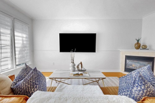 67 Cathedral Bluffs Drive, Toronto, ON - Indoor Photo Showing Living Room With Fireplace