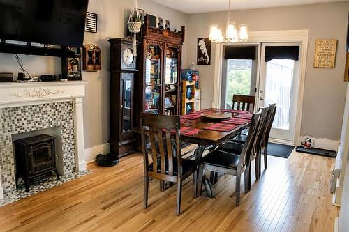 327 Machray Ave, Winnipeg, MB - Indoor Photo Showing Dining Room With Fireplace