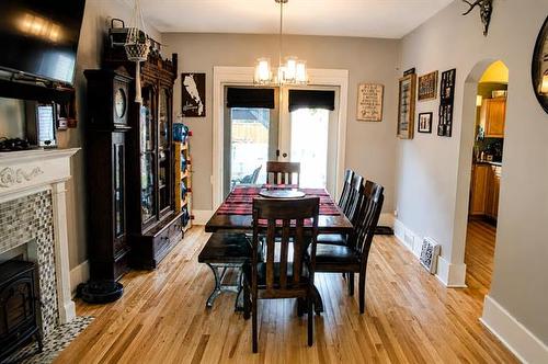 327 Machray Ave, Winnipeg, MB - Indoor Photo Showing Dining Room With Fireplace