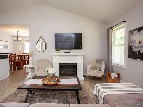 22 170 Schoolhouse Lane, Stanley Bridge, PE - Indoor Photo Showing Living Room With Fireplace