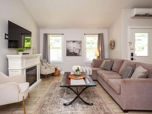 22 170 Schoolhouse Lane, Stanley Bridge, PE - Indoor Photo Showing Living Room With Fireplace